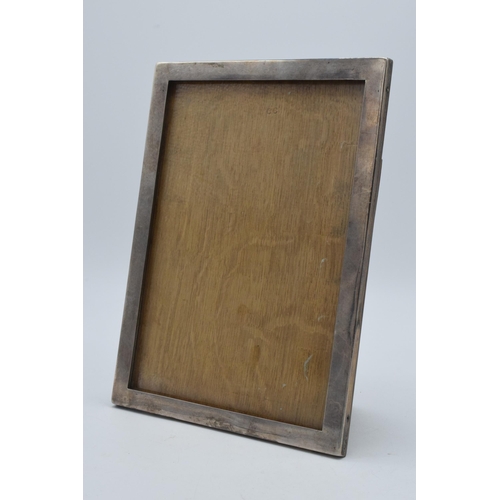 166 - Silver photo frame with easel back, Birmingham 1902, glazed, 22.5cm tall.