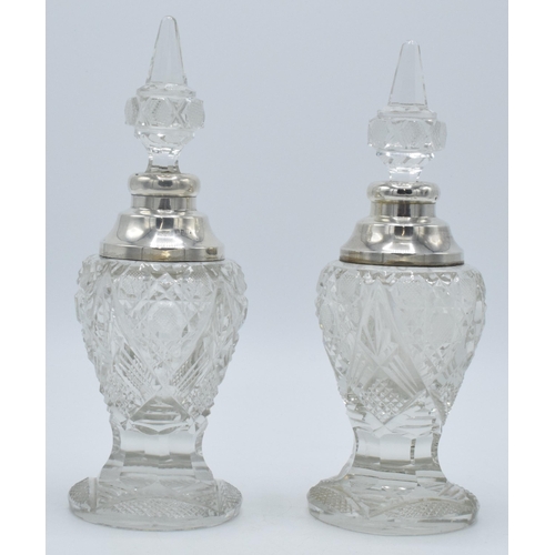 172 - A near pair of silver and cut glass perfume bottles, one London 1904, the other London 1926, both by... 