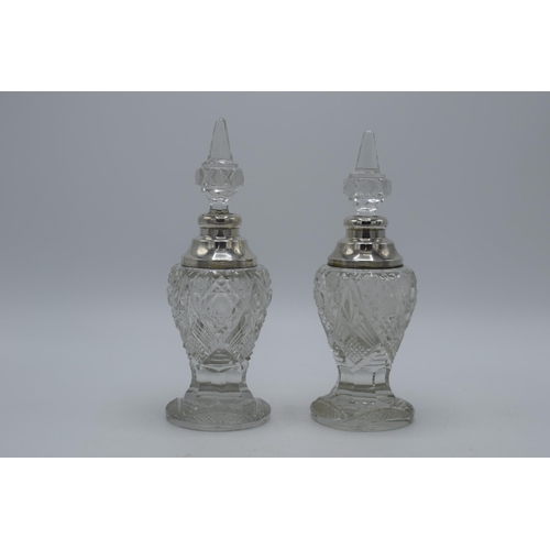 172 - A near pair of silver and cut glass perfume bottles, one London 1904, the other London 1926, both by... 