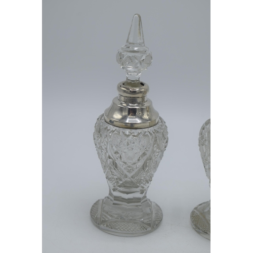 172 - A near pair of silver and cut glass perfume bottles, one London 1904, the other London 1926, both by... 