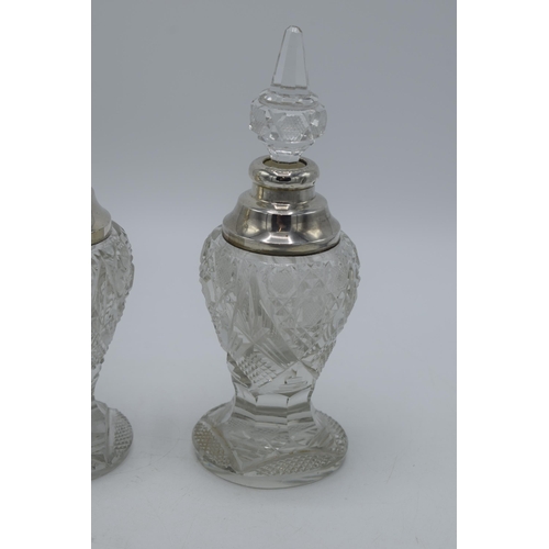 172 - A near pair of silver and cut glass perfume bottles, one London 1904, the other London 1926, both by... 