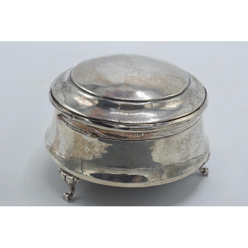 173 - Silver trinket box with velvet lining, Chester 1916, raised on three feet, 7.5cm diameter.