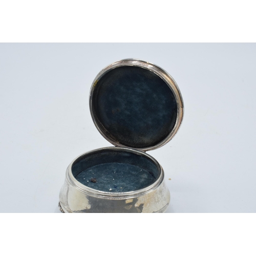 173 - Silver trinket box with velvet lining, Chester 1916, raised on three feet, 7.5cm diameter.