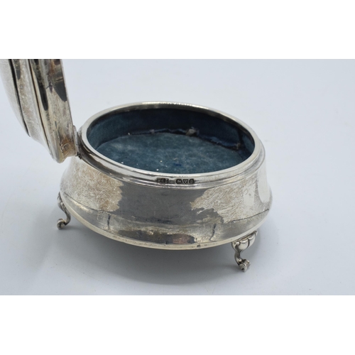 173 - Silver trinket box with velvet lining, Chester 1916, raised on three feet, 7.5cm diameter.