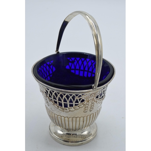 175 - Silver sugar basket with blue glass liner, London 1896 'CR', 100.4 grams, 12.5cm tall.