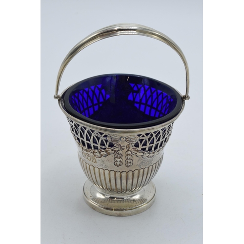 175 - Silver sugar basket with blue glass liner, London 1896 'CR', 100.4 grams, 12.5cm tall.