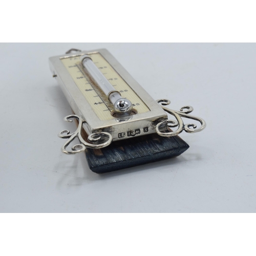 177 - Silver easel-back thermometer with ornate supports, Birmingham 1922 'LE', 10cm tall.