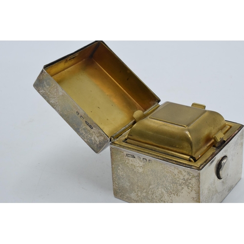 196 - Silver travelling inkwell in cube form, Birmingham 1909, GY & Co, with glass liner, 5cm tall.