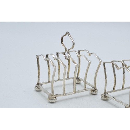 197 - A pair of silver toast racks with each having space for 4 slices, Birmingham 1925, Adie Bros, 73.0 g... 