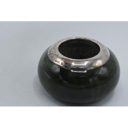 198 - Green hardstone match holder and striker with silver rim, Birmingham 1901, 6cm diameter.