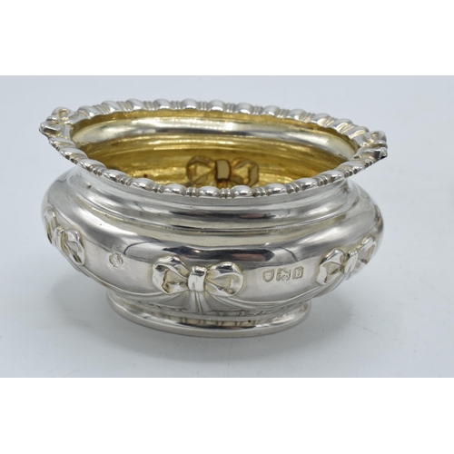 199 - A pair of silver table salts with embossed decoration of a bow and similar, London 1897, 80.4 grams,... 