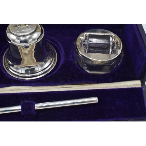 204 - Cased silver writing travelling set to include an inkwell, a brush, a stamp, a roller and an associa... 