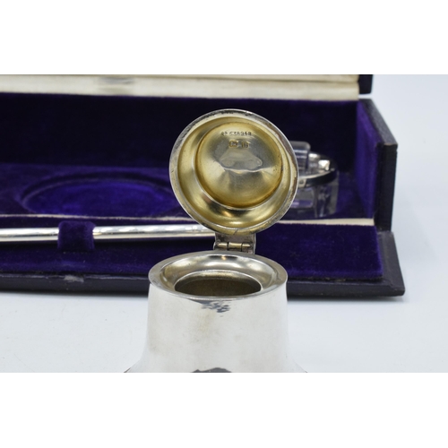 204 - Cased silver writing travelling set to include an inkwell, a brush, a stamp, a roller and an associa... 