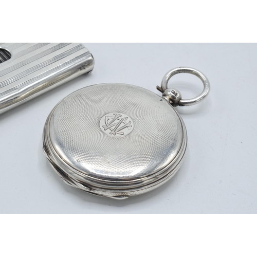 210 - A silver pocket watch case with masonic symbol to front together with a striped silver cigarette cas... 