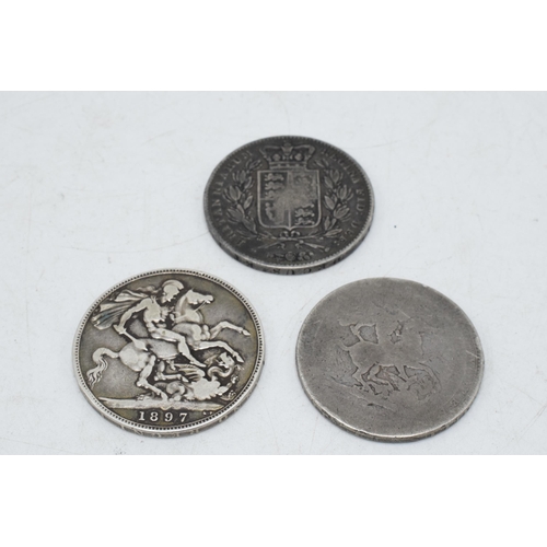 3 - A trio of silver crowns to include 1845 Shield Back Young Head Victoria, 1897 example and a badly wo... 