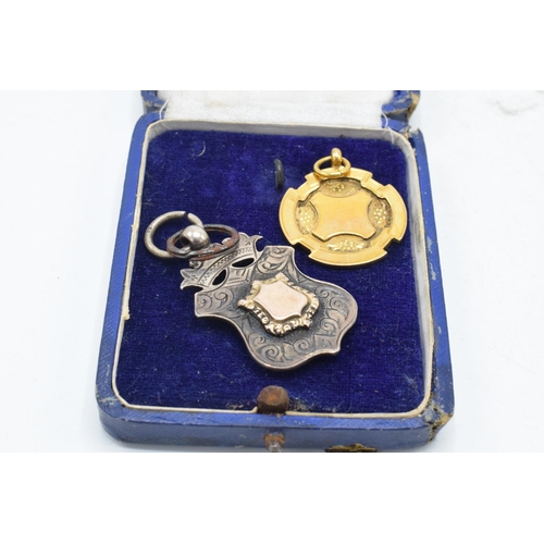 313 - 9ct gold fob 'MVCC 1927-1928', 5.0 grams, together with silver fob 'HVCC 1905', 10.6 grams (2).