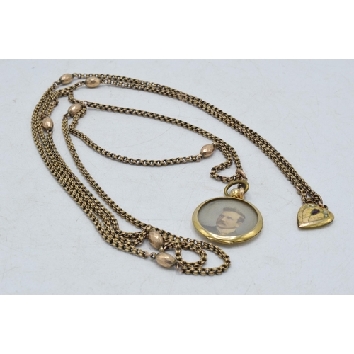 317 - 9ct gold longuard chain with lozenge-style beads with 9ct gold locket and gilt metal heart shaped pe... 