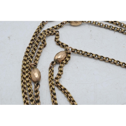 317 - 9ct gold longuard chain with lozenge-style beads with 9ct gold locket and gilt metal heart shaped pe... 