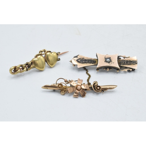 326 - A trio of 9ct gold bar brooches, total weight 7.8 grams, all with damages, one with metal pin (3).