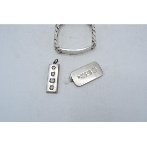 327 - A trio of silver jewellery to include 2 ingots, one London 1976, the other Sheffield 1978 and a silv... 