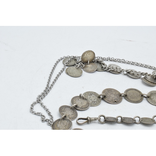 328 - A trio of silver / white metal jewellery items to include a threepenny bit bracelet, a foreign coina... 