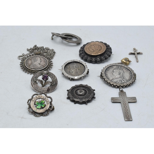 330 - A collection of silver and silver coloured jewellery to include Victorian coin brooches, a cross pen... 