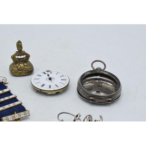 332 - A collection of items to include a white metal chain fob / seal, a brass example, silver riding crop... 