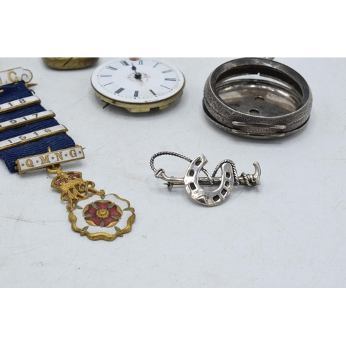 332 - A collection of items to include a white metal chain fob / seal, a brass example, silver riding crop... 