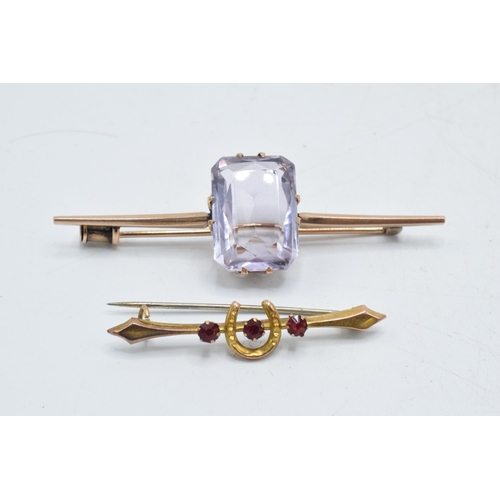 338 - A pair of 9ct gold bar brooches, one with a horseshoe set with garnets, base metal pin, together wit... 