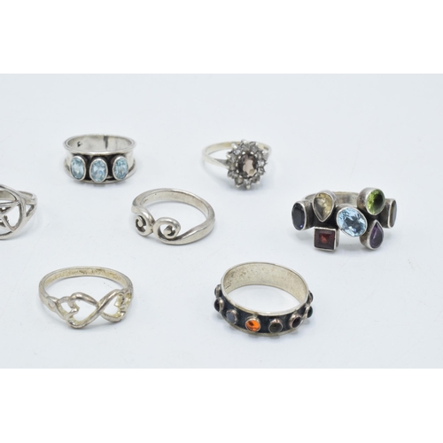 372 - A good collection of silver rings, set with various stones in multiple styles and sizes, 32.1 grams ... 