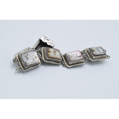 375 - Silver .800 bracelet with Mother of Pearl carved panels, approx 20cm long.