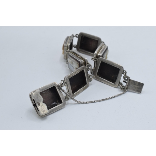 375 - Silver .800 bracelet with Mother of Pearl carved panels, approx 20cm long.