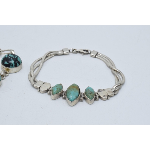 377 - A pair of ladies bracelets, each set with turquoise-effect inserts, longest 20cm (2).