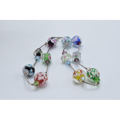 379 - A silver ladies bracelet together with silver and white meal murano-style glass beads necklace, 43cm... 