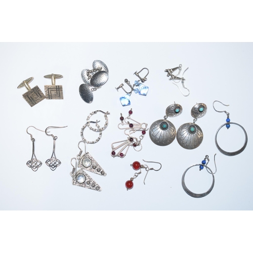 390 - A collection of silver earrings to include in the Art Nouveau style, stone set examples and other to... 