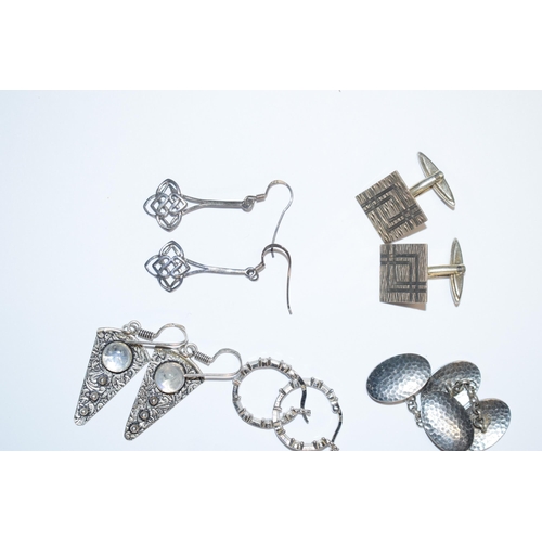 390 - A collection of silver earrings to include in the Art Nouveau style, stone set examples and other to... 