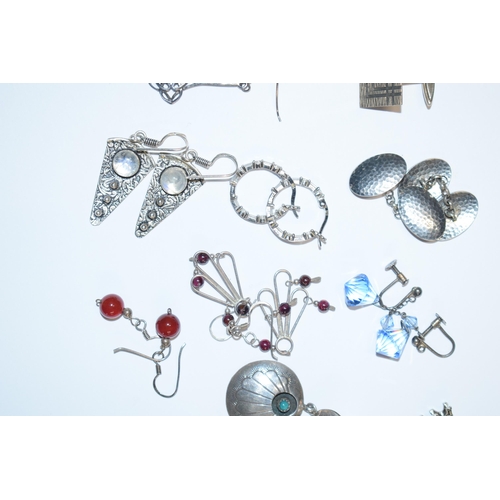 390 - A collection of silver earrings to include in the Art Nouveau style, stone set examples and other to... 