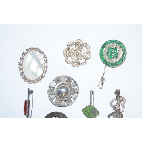 391 - An interesting collection of silver jewellery to include enamelled fobs, Victorian brooches, pendant... 