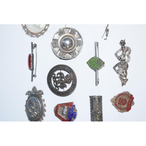 391 - An interesting collection of silver jewellery to include enamelled fobs, Victorian brooches, pendant... 