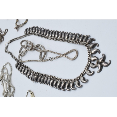 394 - A collection of silver chains and necklaces of varying lengths and styles, 190.8 grams.