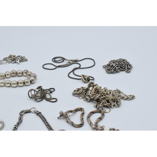 394 - A collection of silver chains and necklaces of varying lengths and styles, 190.8 grams.