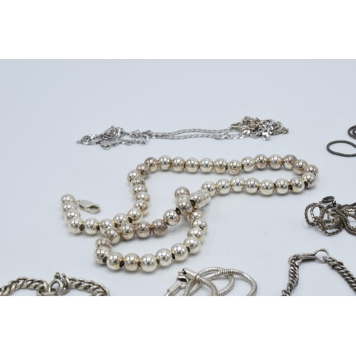 394 - A collection of silver chains and necklaces of varying lengths and styles, 190.8 grams.