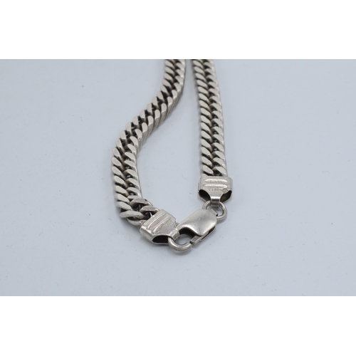 396 - Silver curb link chain, 66.5 grams, 51.5cm long.