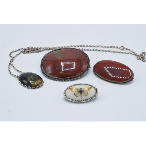 400 - An enamel brooch of a butterfly in white metal case together 3 silver cased hardstone brooches (4).