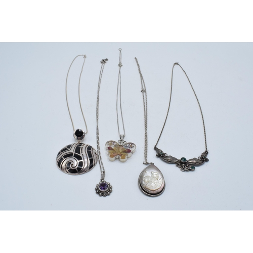 403 - A collection of silver necklaces each with pendants to include Mother of Pearl and others (5).