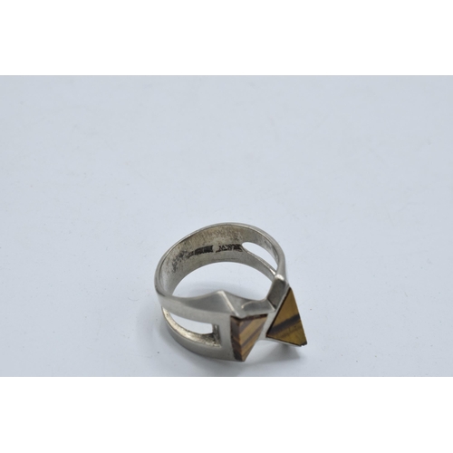 405 - Silver chunky ornate ring set with large tiger's eye together with a modernist similar example (2).