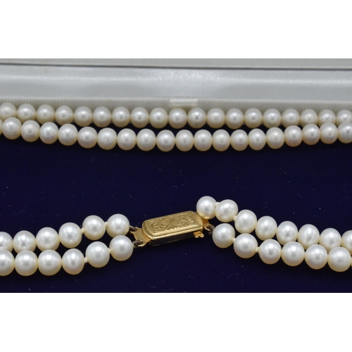 407 - Lotus cultured pearl double strand necklace with 9ct gold clasp, 42cm long, in original box.