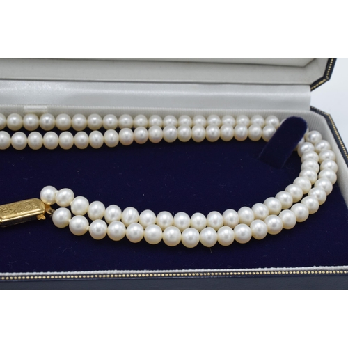 407 - Lotus cultured pearl double strand necklace with 9ct gold clasp, 42cm long, in original box.