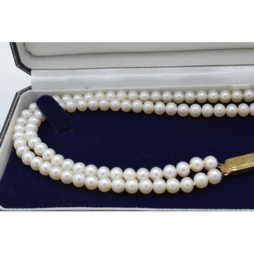 407 - Lotus cultured pearl double strand necklace with 9ct gold clasp, 42cm long, in original box.