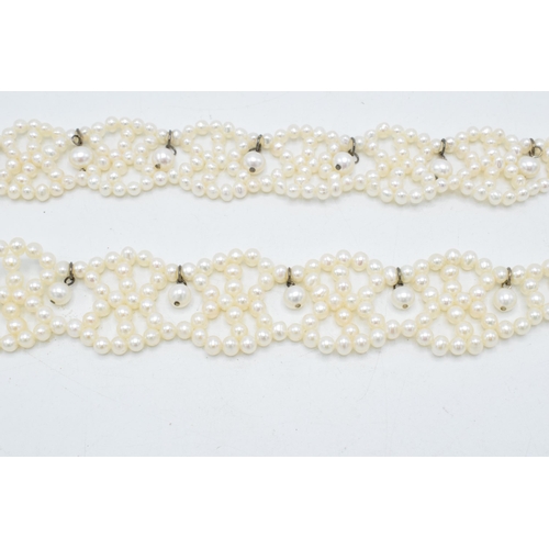 408 - A pair of silver mounted pearl bracelets, 19.5cm long (2).